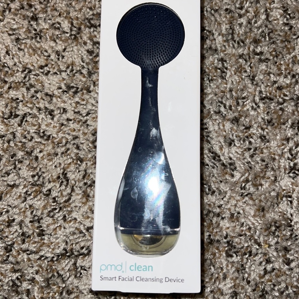 New in box pmd Smart facial cleansing device in midnight blue.